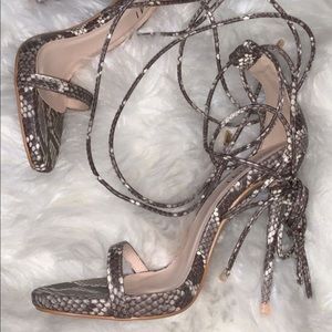 Snake print tie up heels